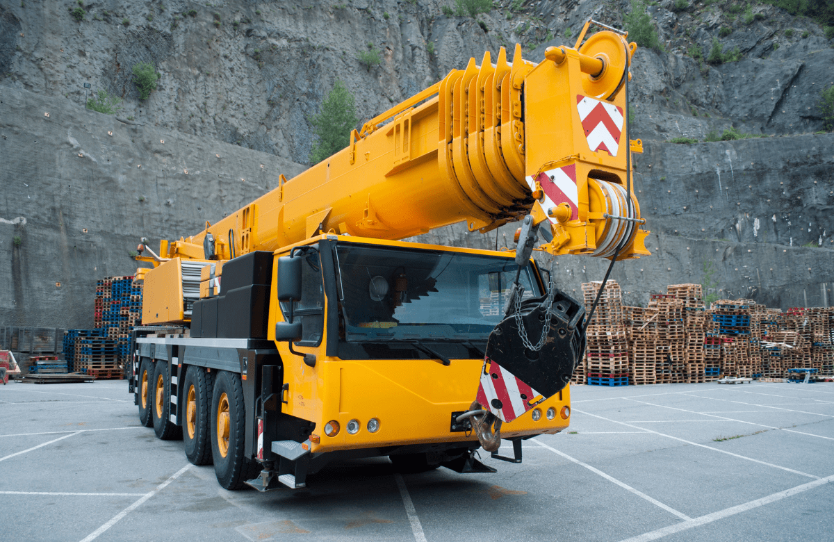 A student operating a mobile crane under the guidance of an instructor during a hands-on practical training session at Bigfoot Academy.
