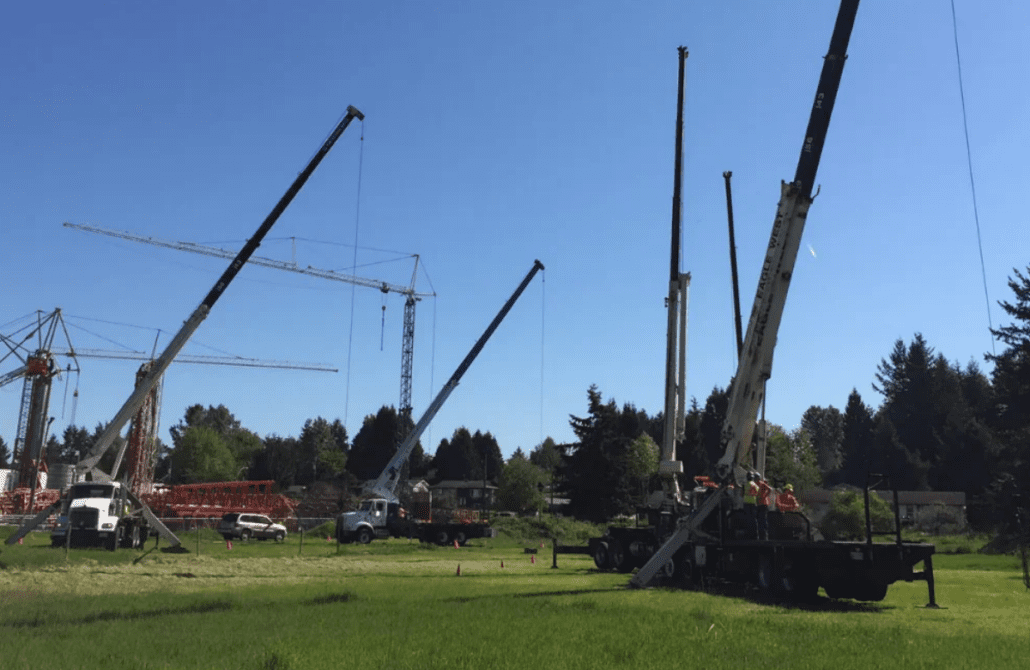 An operator practicing a lift with a truck-mounted stiff boom crane during a Bigfoot Academy certification course. 