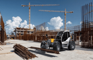 Operator receiving on-site IVES telehandler training from a Bigfoot Academy instructor. 