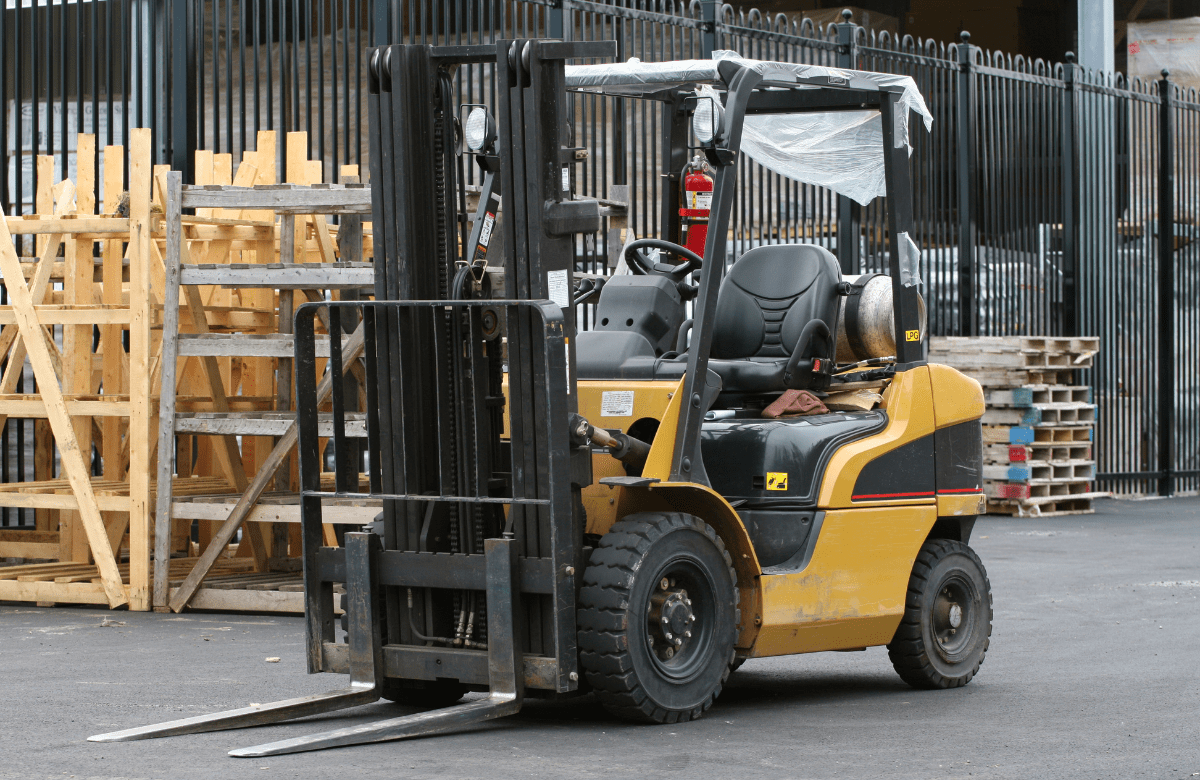 Employees receiving hands-on forklift safety certification from an IVES-certified trainer. 