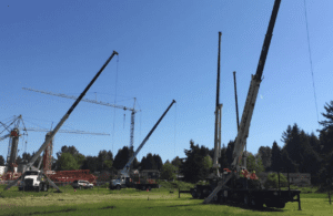 A trainee learning to operate a truck-mounted stiff boom crane during a certification program at Bigfoot Academy. 