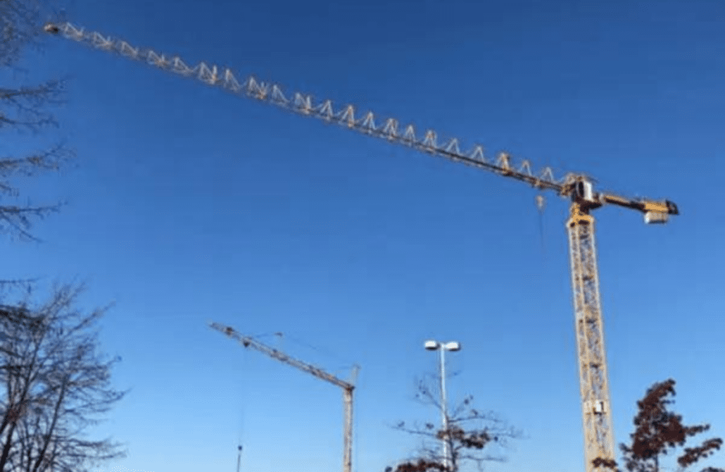 2018 Potain MDT219 J10 top-slewing tower crane on a construction site.