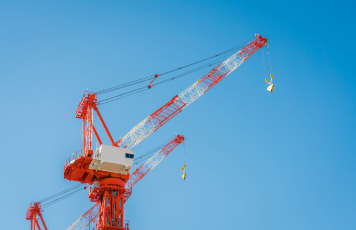 Red and white tower crane.