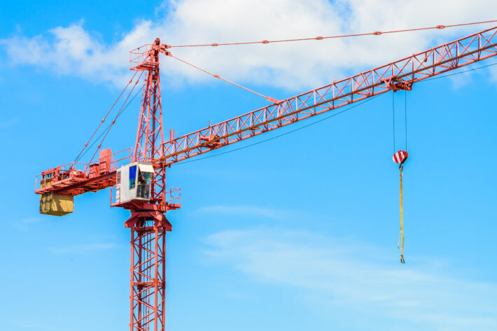 Red construction tower crane.