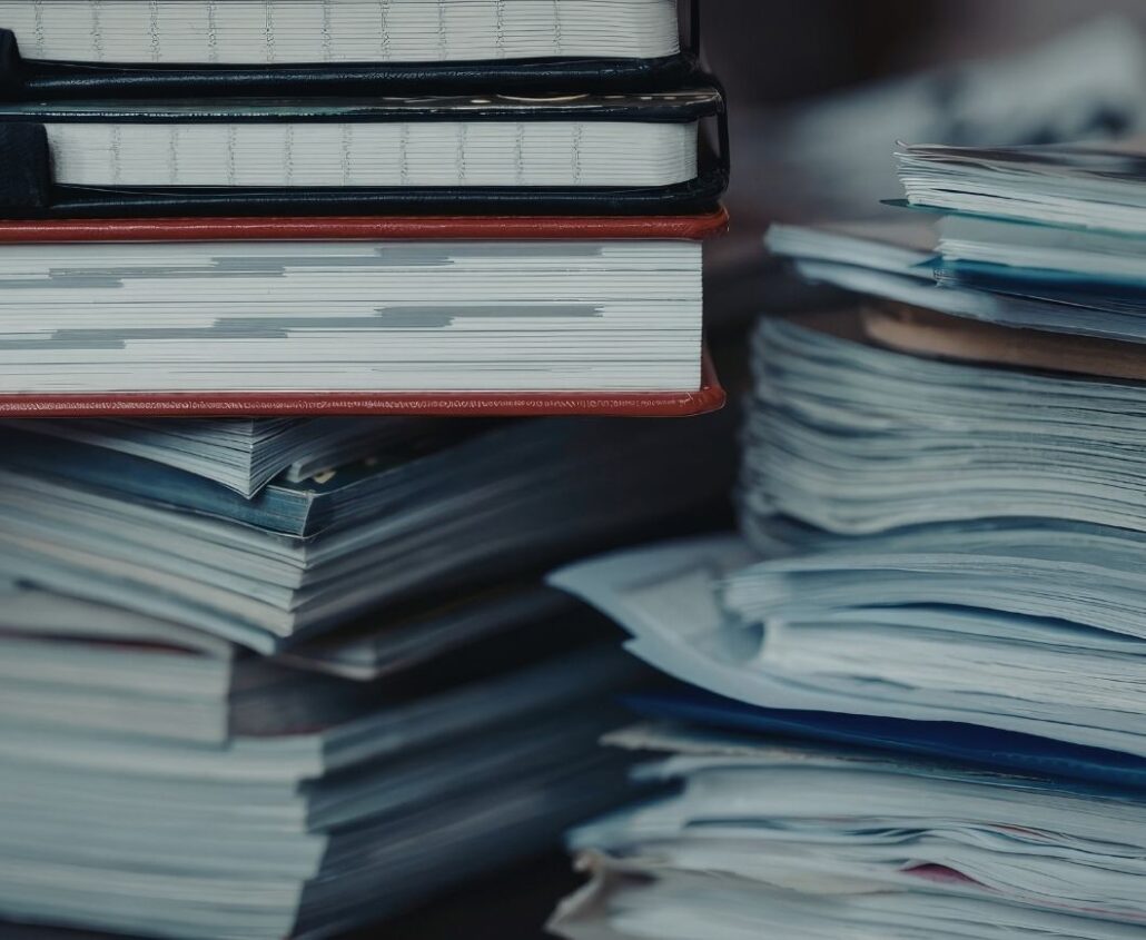 Binders filled with construction and crane compliance documents and safety records